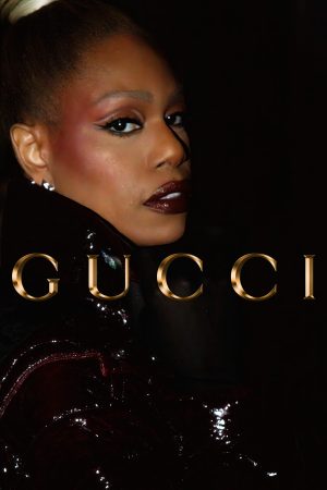 Close-up of a model with dramatic makeup in a Gucci advertisement.